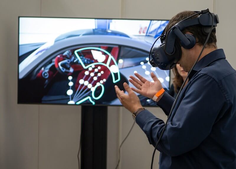 Image of a person using a head-mounted display using augmented reality